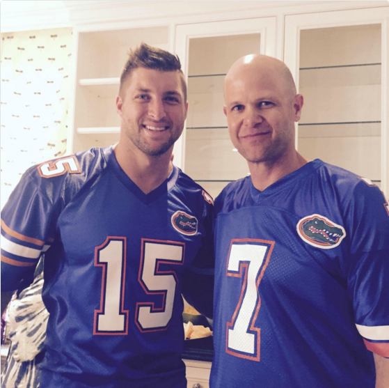 Tim Tebow with Danny Wuerffel in uniform